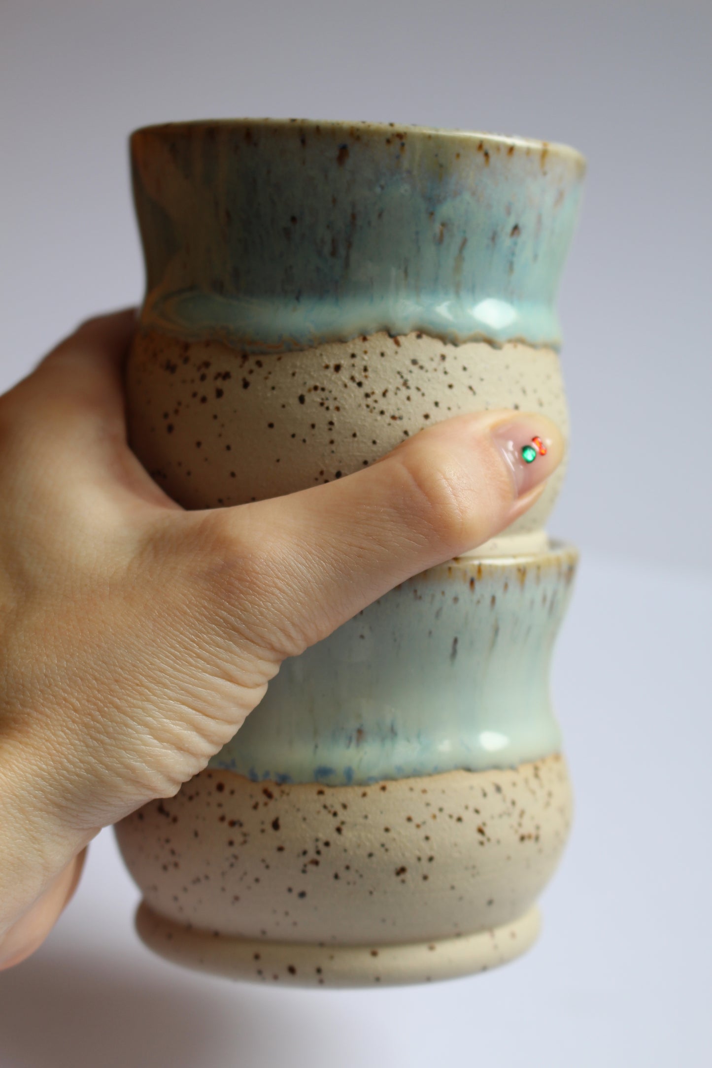 White/blue speckled coffee tumblers