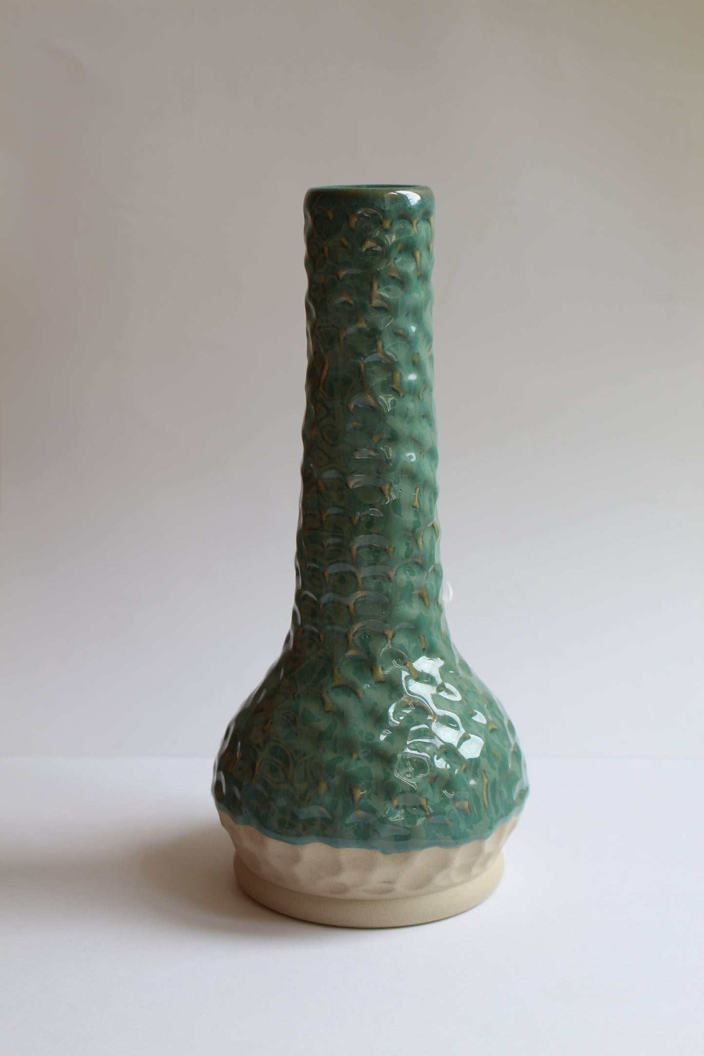 Small light greenish blue vase