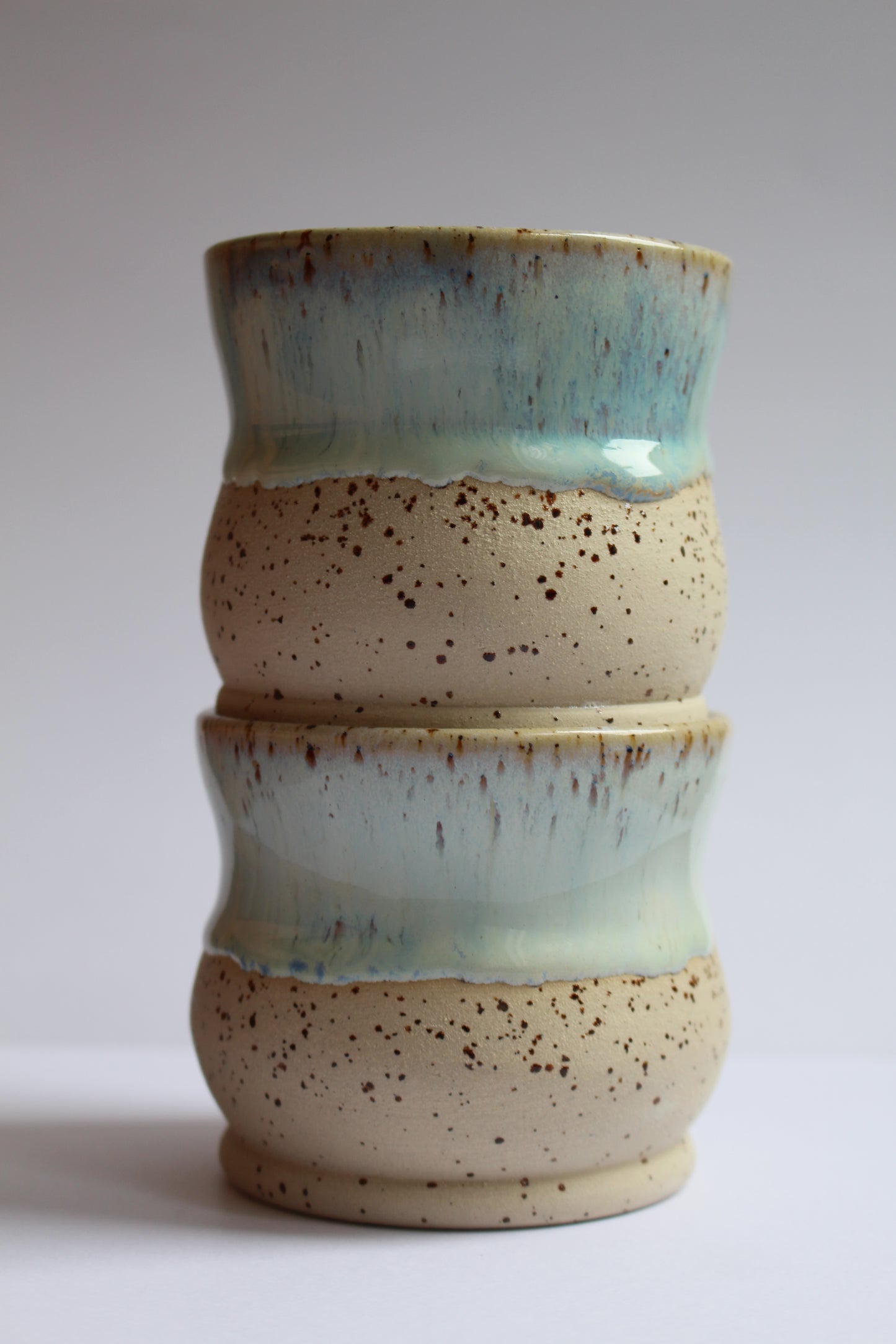 White/blue speckled coffee tumblers