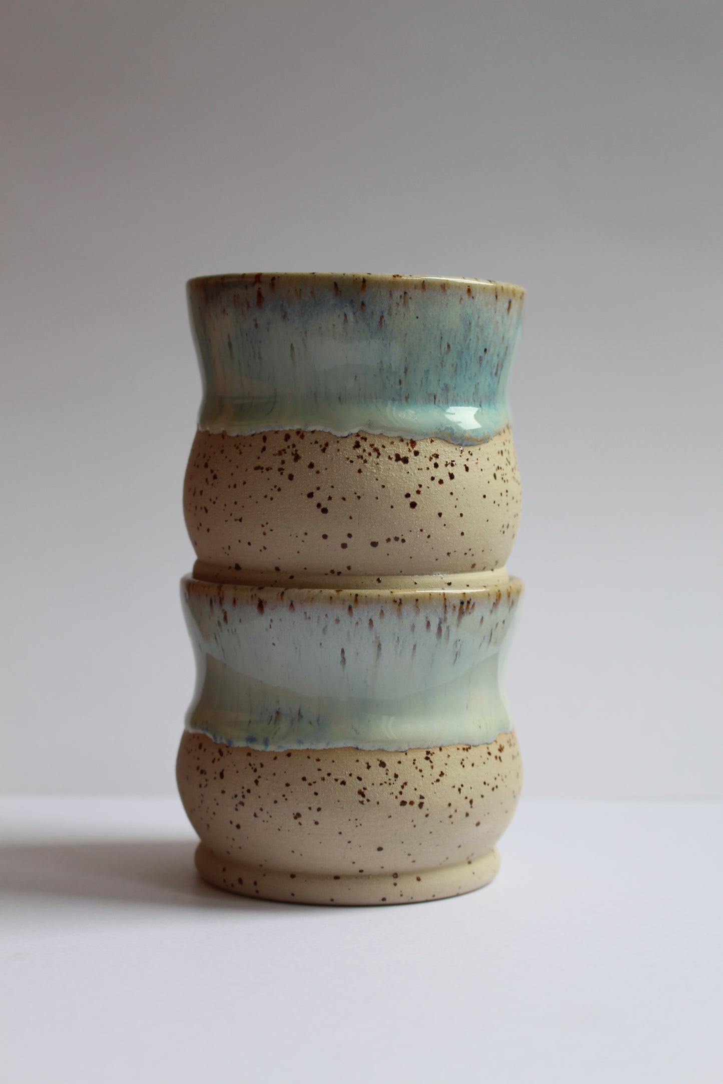 White/blue speckled coffee tumblers