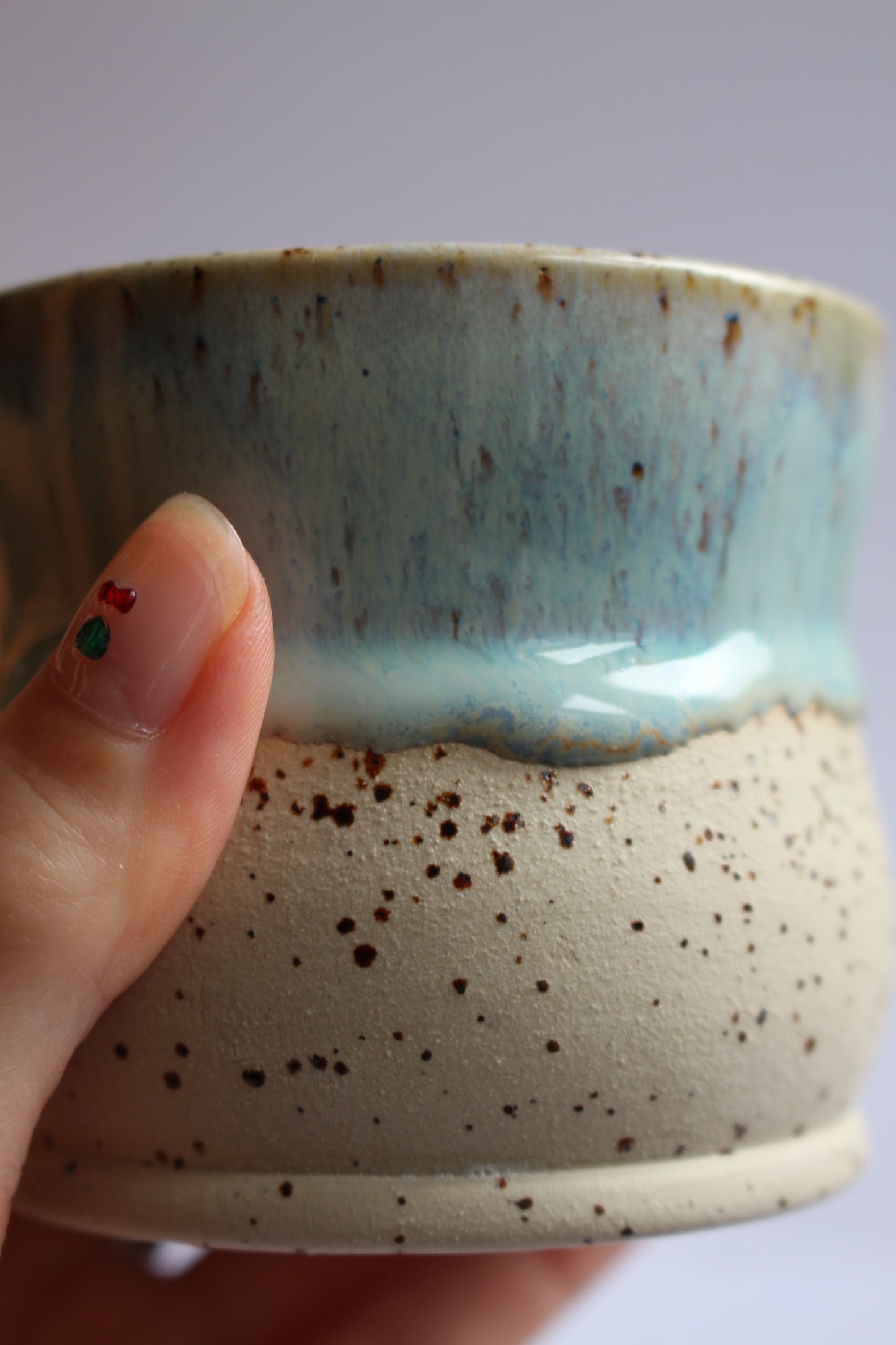 White/blue speckled coffee tumblers